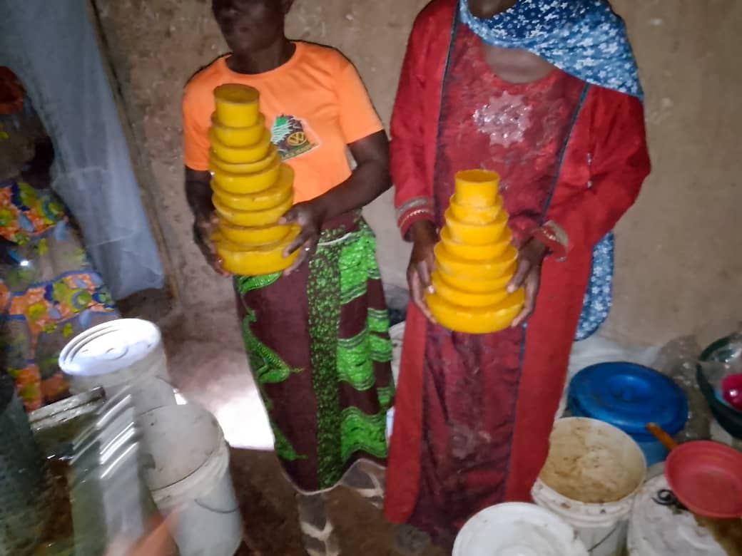 women with beeswax ingots